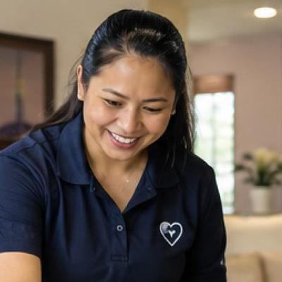 A MapleBridge team member cleaning a client's home